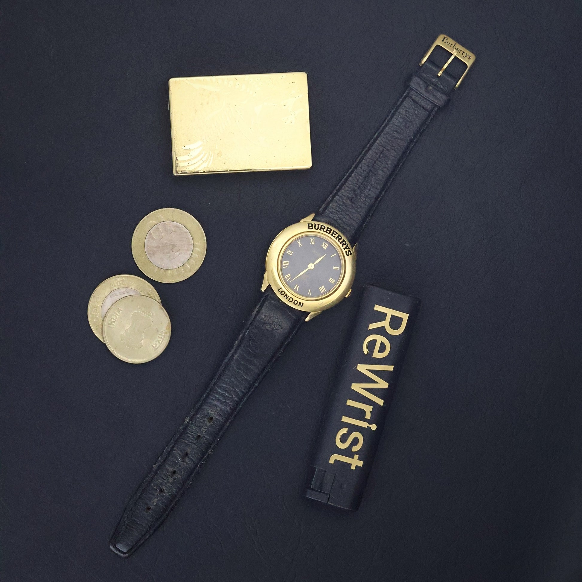 Burberrys London | Gold Round | Engraved Bezel | Black Roman Dial