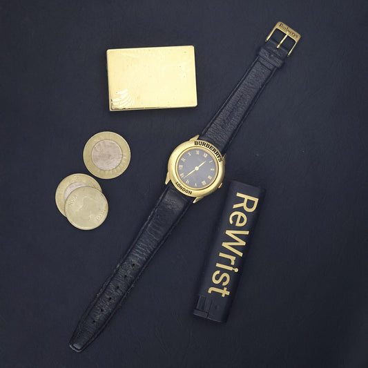 Burberrys London | Gold Round | Engraved Bezel | Black Roman Dial