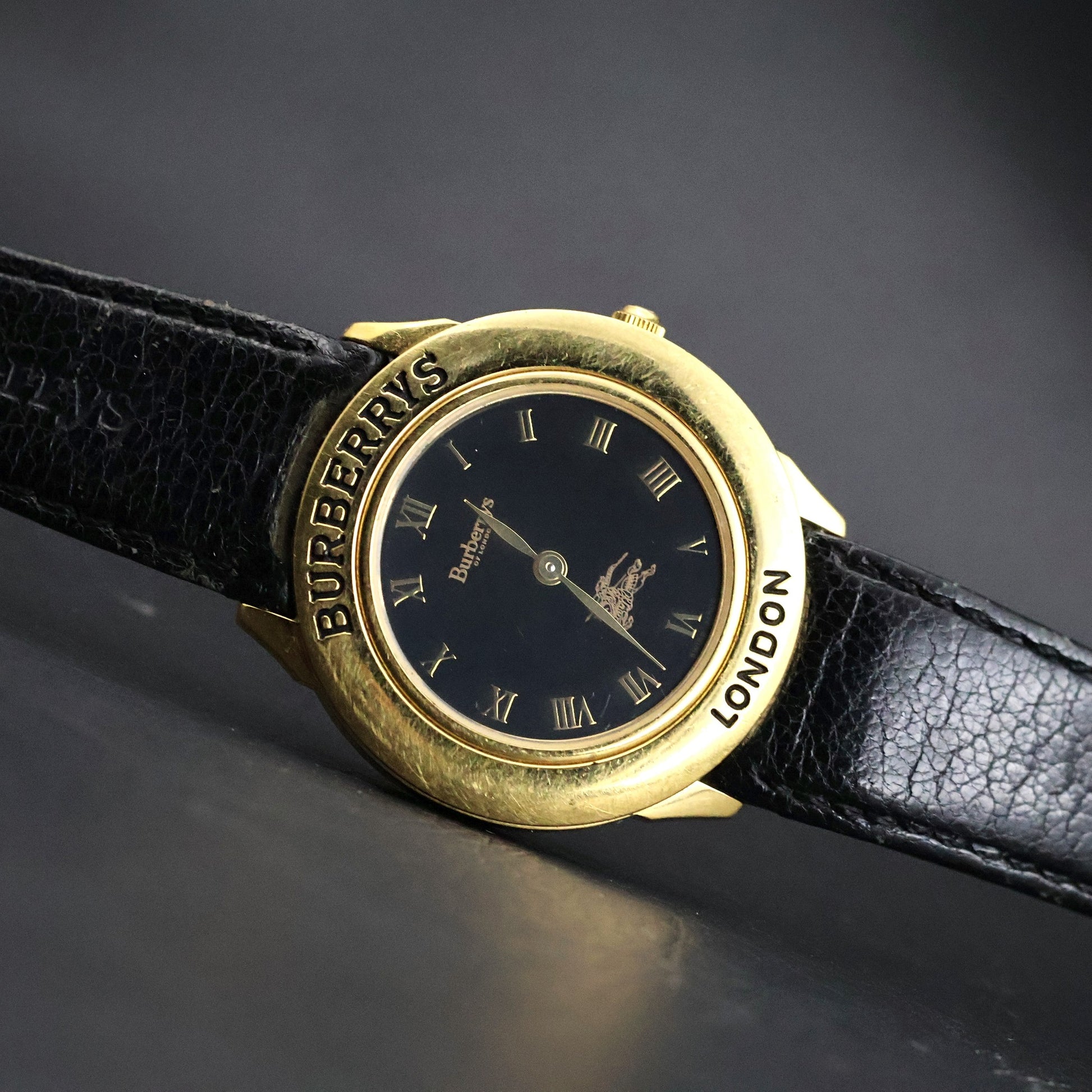 Burberrys London | Gold Round | Engraved Bezel | Black Roman Dial