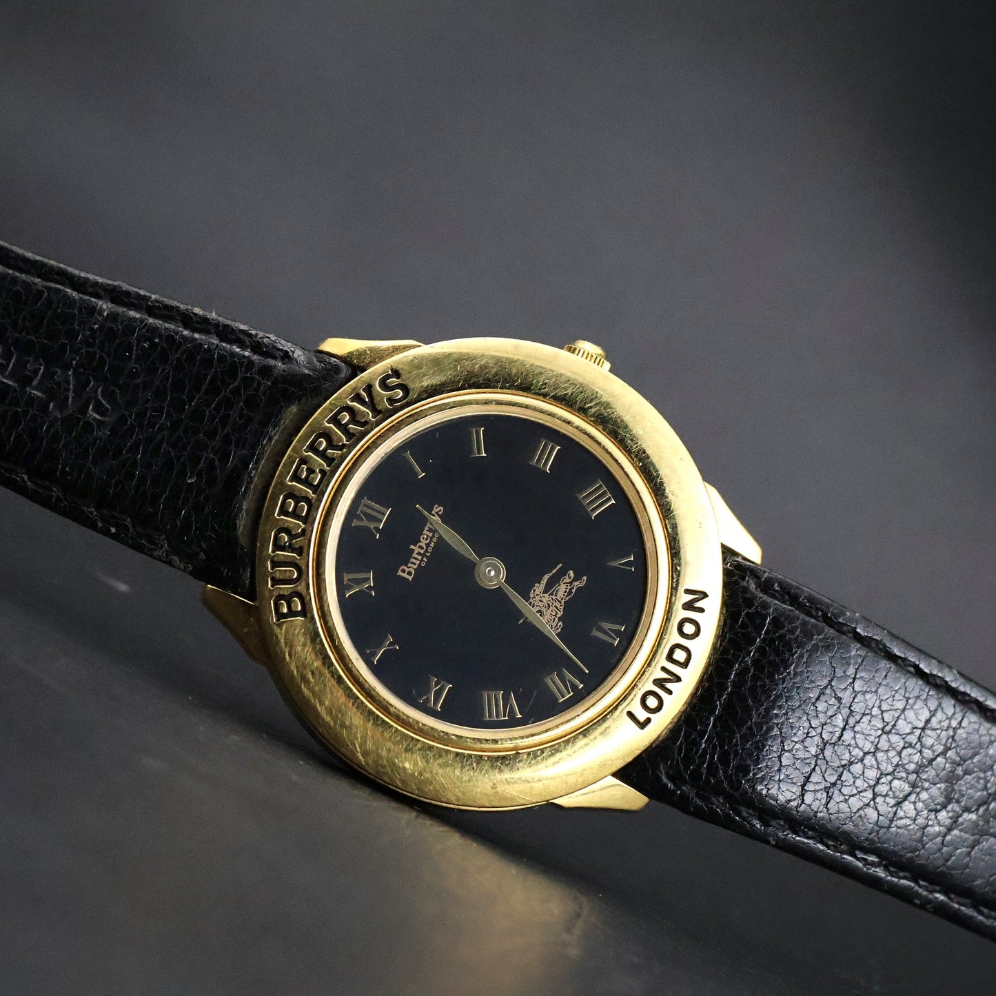 Burberrys London | Gold Round | Engraved Bezel | Black Roman Dial