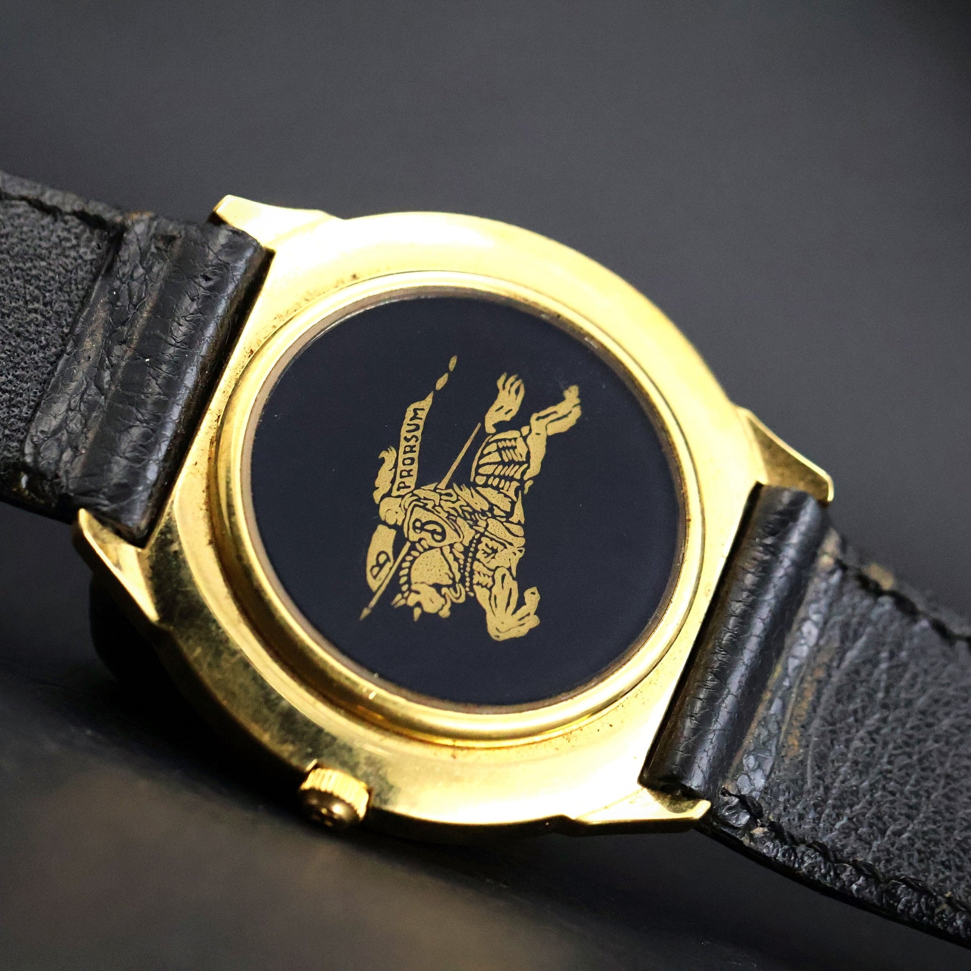 Burberrys London | Gold Round | Engraved Bezel | Black Roman Dial