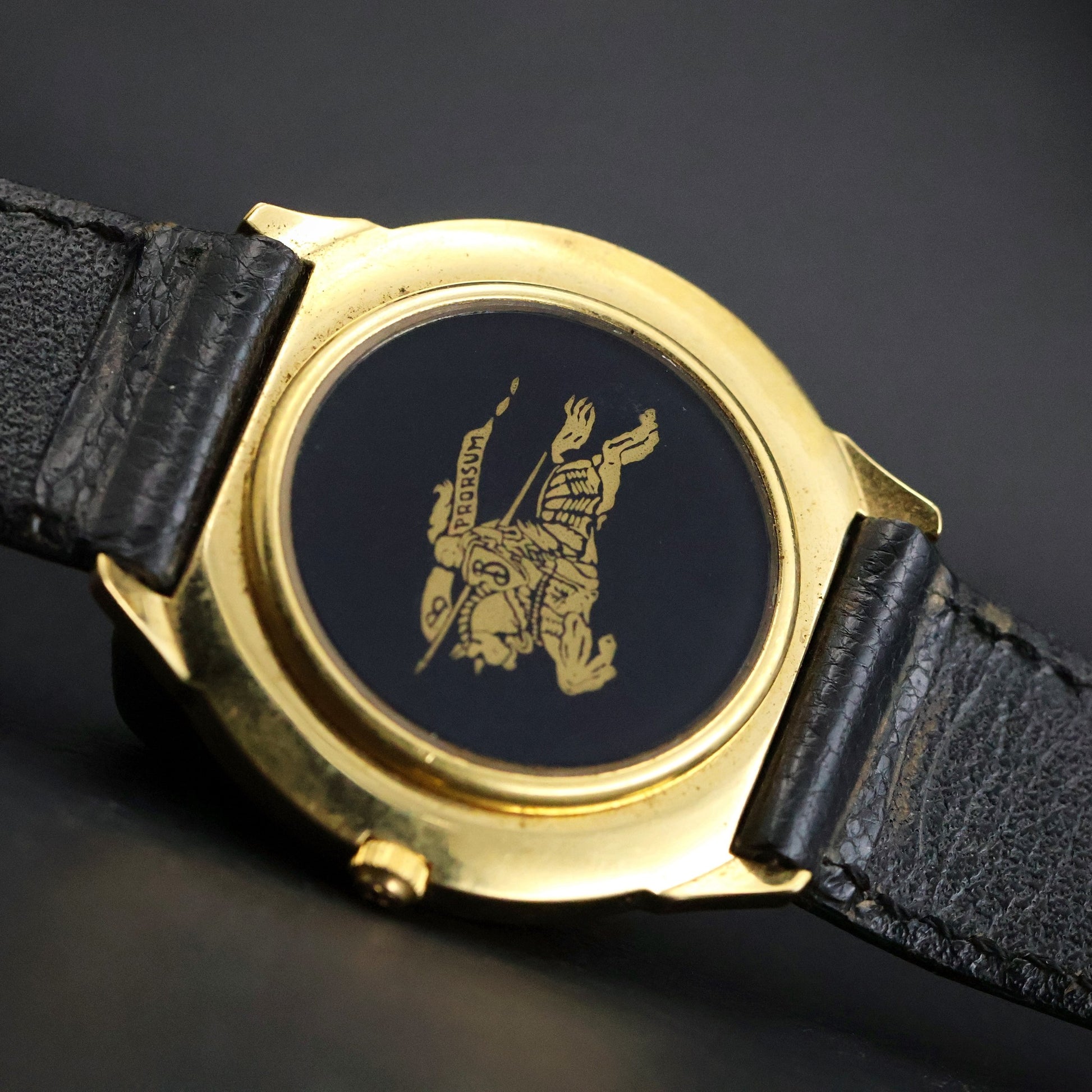 Burberrys London | Gold Round | Engraved Bezel | Black Roman Dial